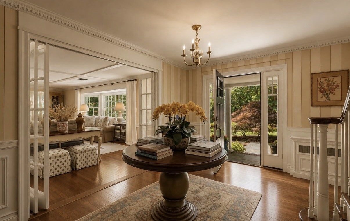 Entry hall of the Muttontown project, looking through French doors to a sunlit sitting room